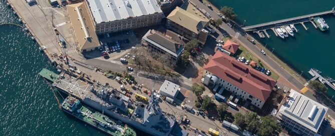 Bird-eye view of a naval ship in port