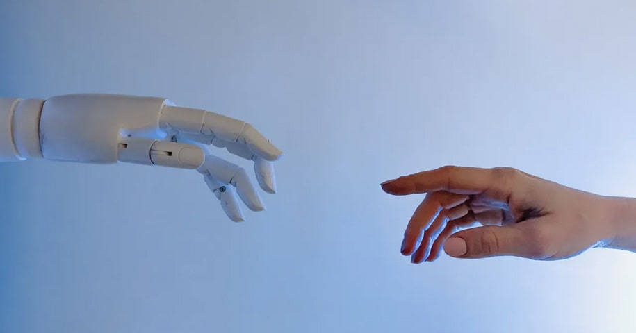 AI hand and human hand about to touch