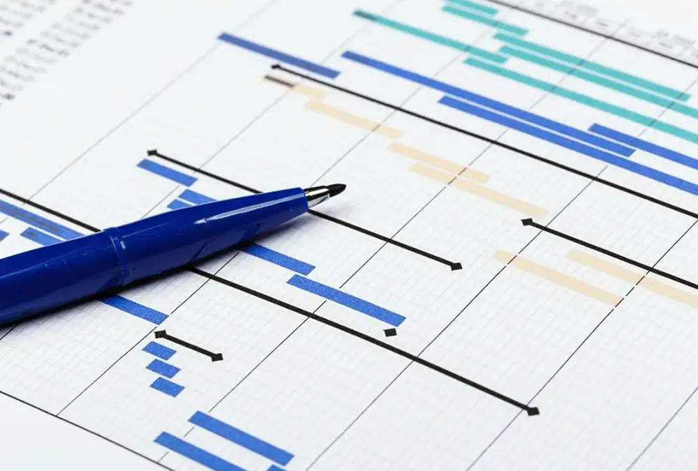 Pen placed on top of compliance reports