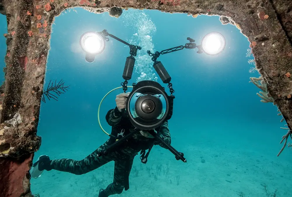Deep sea diver exploring a shipwreck