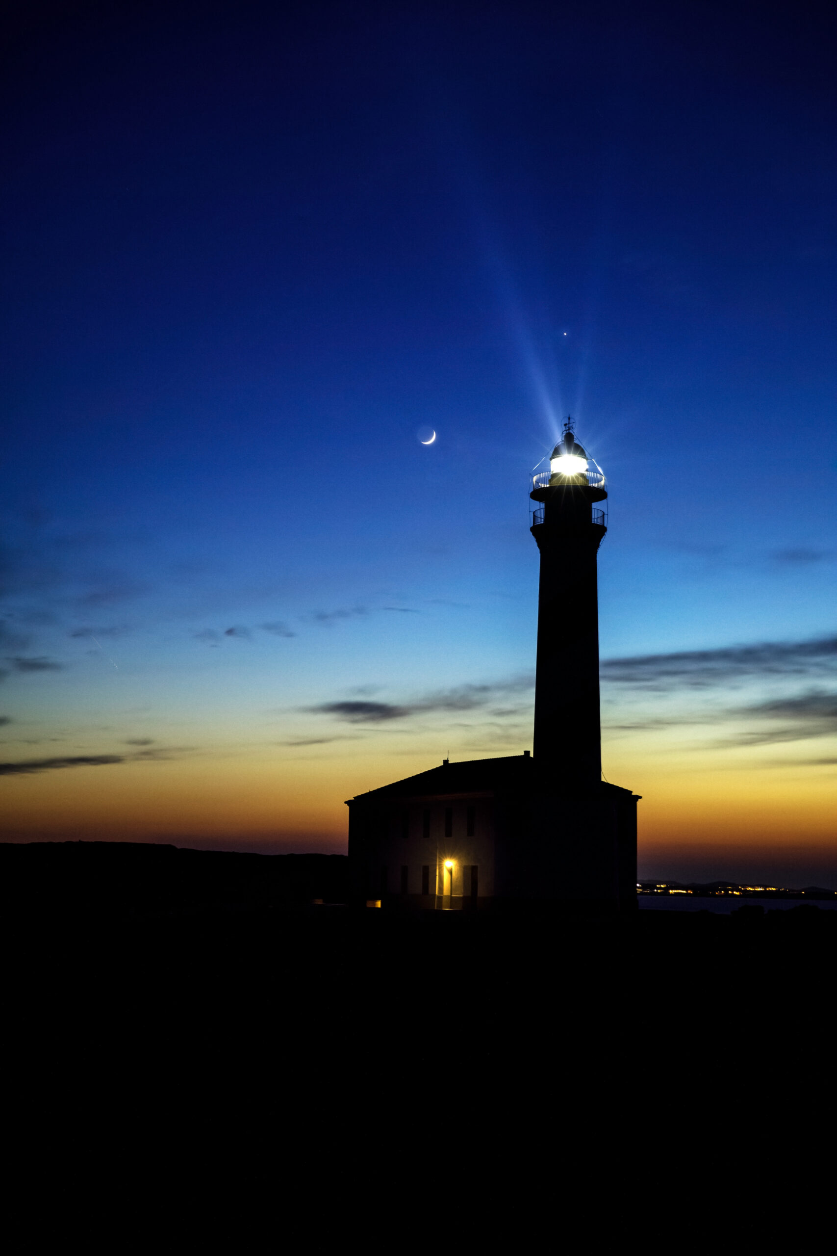 Sea lighthouse with the moon