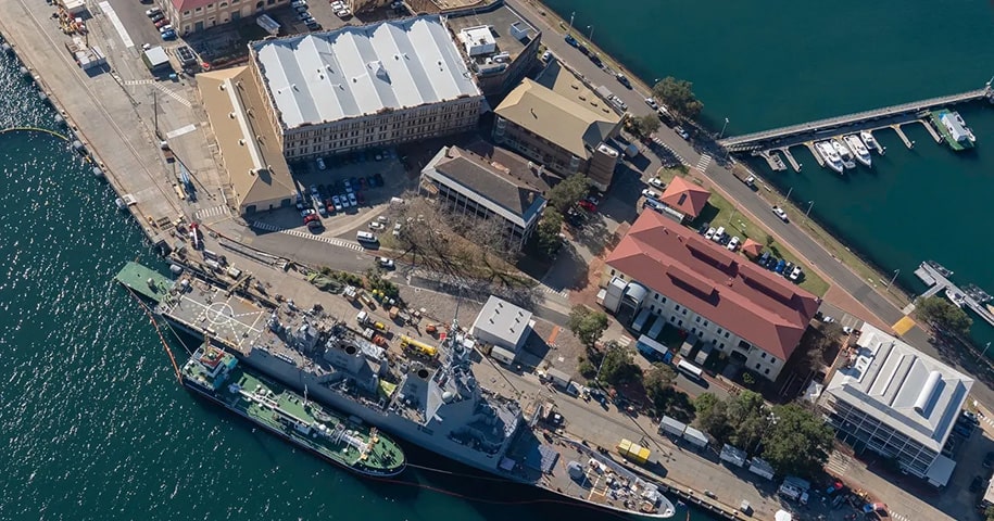 coastal_security-min Bird-eye view of a naval ship in port