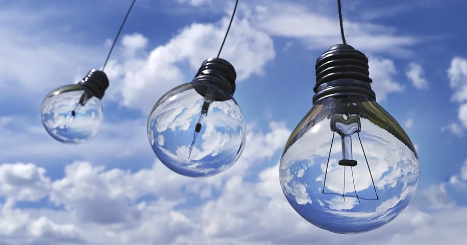 Light bulbs floating in the sky