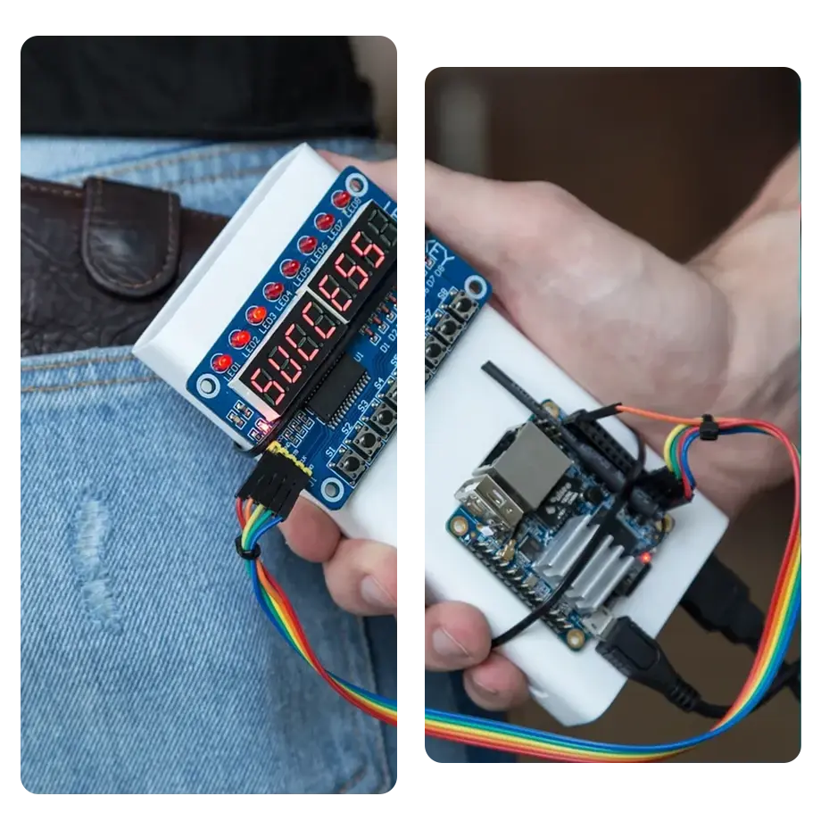Man holding a hacking device behind his back