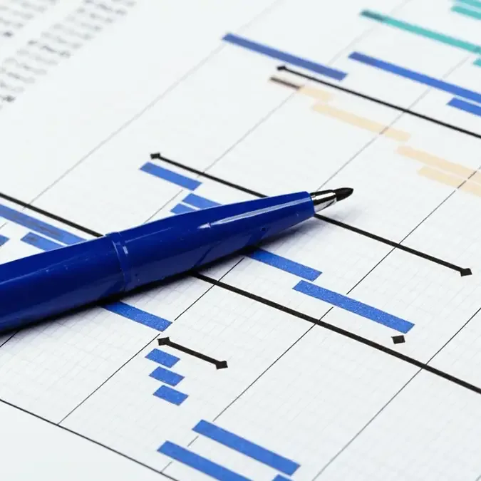 Pen placed on top of compliance reports