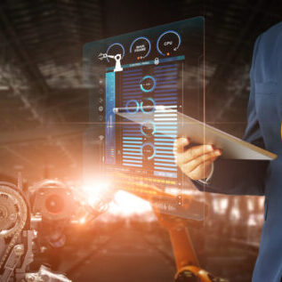 Manager engineer check and control automation robot arms machine in intelligent factory industrial on real time monitoring data software. Welding robotics and manufacturing operation.