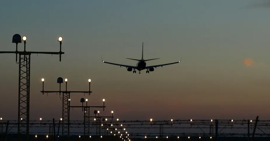 Plane landing at dusk