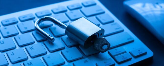 Padlock unlocked on top of a keyboard