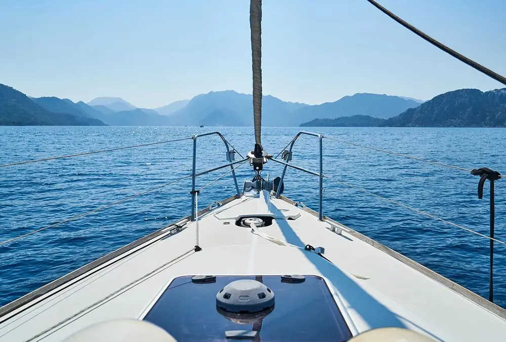 Yacht sailing toward coastline